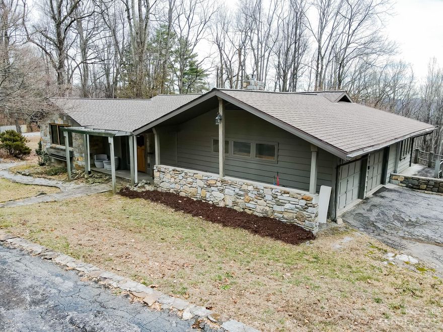 If you have looked for a home to remodel close to Laurel Park consider this traditional ranch with garage and extra large homesite. With winter views to the South this home has the potential to be a legacy property for you and those you want to share it with. One level living with primary suite and guest rooms on first floor.  A massive basement space with hobby/ Craft area, workshop,  room for a pingpong table, outdoor kitchen so much more. On the main level the  kitchen has plenty of light with an eat in area surrounded by windows. The living area  has a beautiful fireplace and woodturning stove. This home is in the middle of being remodeled so bring your imagination. It is very clean. Huge potential just needs the right new owner to come and make it home. Home shows 2 baths in MLS and a third is stubbed out ready for your own touches on the main level.