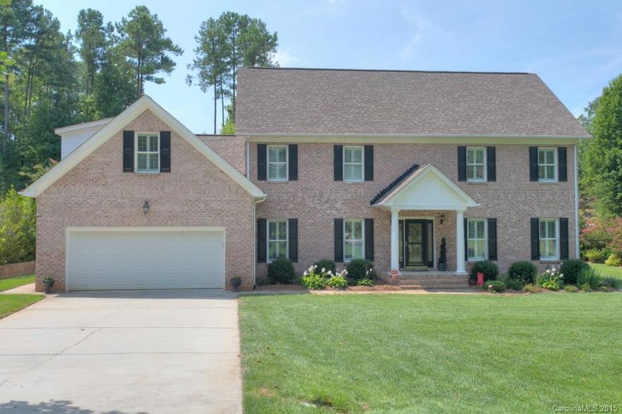 STATELY CENTER- HALL COLONIAL FULL BRICK HOME Oak hardwoods on main. Kitchen w/quartz counters + island. Master bedroom w/trey ceiling, walk in custom closet.  NEW Heated Salt Water swimming pool 400 btu heater, separate zone for just heating hot tub.  Full irrigation provides lush economical landscaping. Four French doors open to  200 sqft Covered Screen porch for additional space.  Marine carpet for easy clean.  Plantation shutters.   Tilt out windows.  2 car oversize garage.