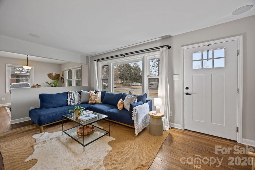 Elevated charm fills this beautifully renovated 3-bedroom, 2-bath home in Windsor Park. Highlights include a magazine-worthy, open-concept kitchen with a curated mix of custom cabinetry, open shelving, and stunning tile backsplashes, flowing seamlessly into the dining and living areas. The primary suite has a private en-suite bath and a custom closet system for optimal storage. Additional features include new windows, hardwood floors throughout (excluding kitchen and baths), and a flat fully fenced backyard -- an entertainers dream!  Conveniently located just minutes from Plaza Midwood and Uptown Charlotte.