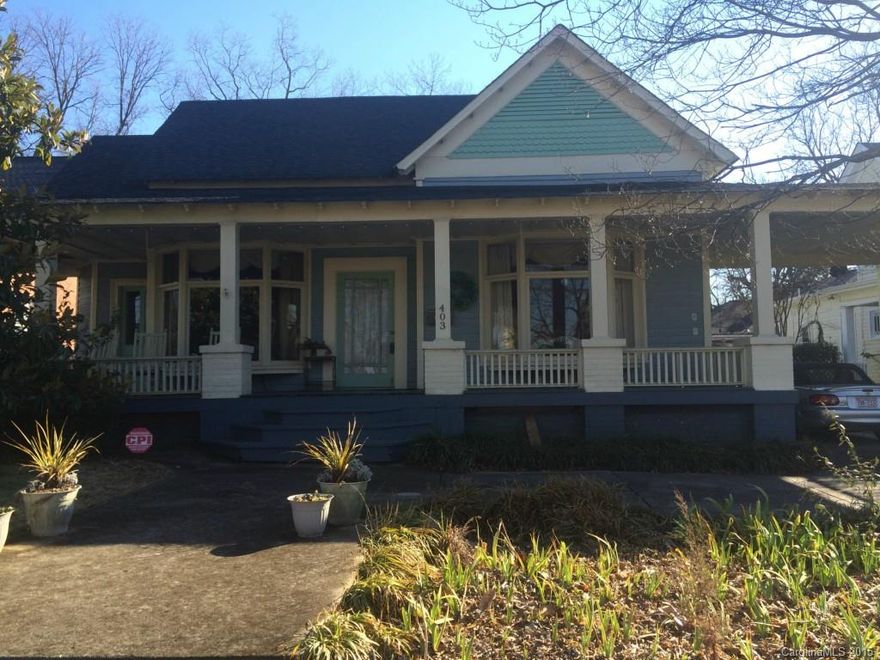 Enjoy sunsets from your large rocking chair front porch. This is a well kept turn of the century home in the heart of the Monroe Historic district.  Detached two car garage has has been finished with window unit for AC and a electric Heat panel. Pool table will remain.  Walking distant from downtown Monroe shopping and dining district.