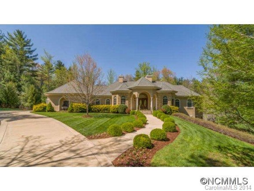 Private and inviting home in one of the most coveted areas in Biltmore Forest, offering the highest quality architectural touches and updates. Striking vaulted entrance with multiple arched doorways leads to a spacious floor plan. Master retreat on main with spa-like bath. Four additional en suite guest rooms and living area on terrace level. Natural light fills the large chef's dream kitchen. Workout room with sauna. Triple heated garage.