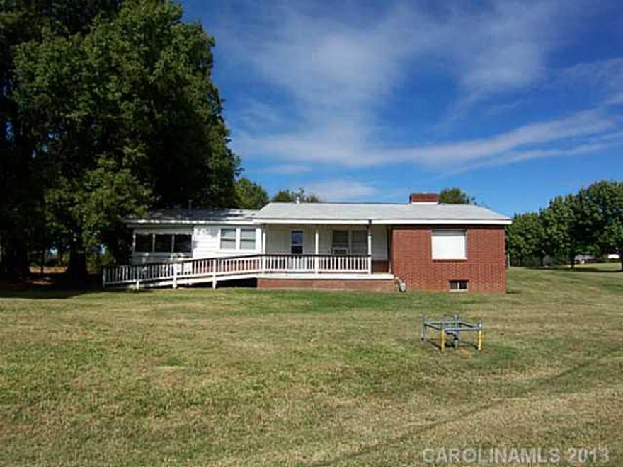 8.48 Acres, side porch, family room and den, bedroom access to one bedroom is thru another. House is heated with a gas heater. AHS Warranty.