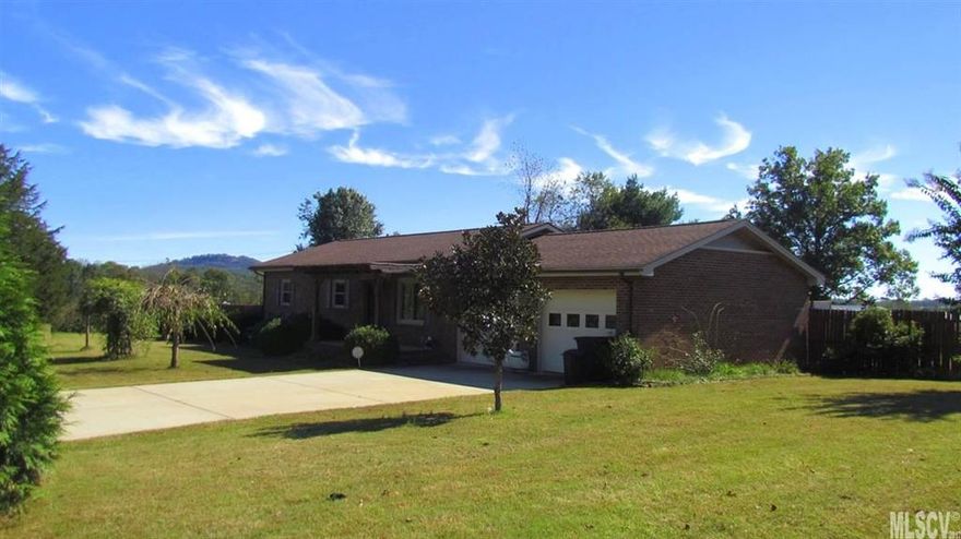 Sugar Loaf township location! Approx. one mile from Sugar Loaf Elementary! This one-level home has a large beautiful yard with .86 of an acre. Outside features mountain views, a variety of flowers & trees, and a huge in-ground pool w/ a viewing deck and diving board! The awesome back yard if fully fenced and there are two outbuildings for storage! The covered front porch leads in to a nice size great room with hardwoods and a large ceiling fan. This open area adjoins the kitchen featuring lots of cabinet space, updated appliances, and a large double sink! The convenient laundry area is tucked away beside the bright and airy den. There are three bedrooms and two full baths.  The split bedroom layout offers a private master suite with huge bathroom and walk-in closet. The two additional bedrooms share the hall bath. There is an additional room currently used as a gym but could be used for an office or playroom. The attached double garage is a great place to store your vehicle and mower!