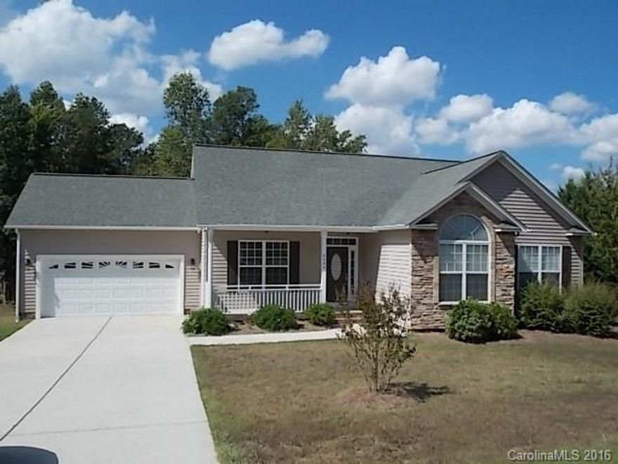 Hurry! Move in ready. 3BR/2BA ranch with 2 car garage on .38 acre lot. Formal Dining and Foyer w/hardwoods. Vaulted Sunroom opens to deck overlooking wooded back yard. Great room has vaulted ceiling and gas FP. Kitchen features stainless appliances including refrigerator, island, tile backsplash, beautiful raised panel wood cabinets, built in microwave, smooth top range, and huge breakfast area. Master with trey ceiling, walk-in closet, bath with separate shower, garden tub, and double vanity.