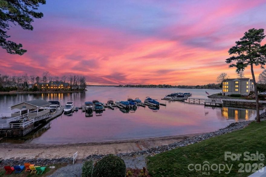 Big-water views are among the most coveted perspectives on Lake Norman—and Residence #404 delivers one of the most breathtaking. Positioned in one of the few locations within the highly desirable Harborgate community where unobstructed sightlines stretch across the lake, this exceptional waterfront condominium captures approximately three miles of open-water views, creating a truly rare and dramatic backdrop for everyday living.

Residence #404 is one of the very select homes within Harborgate that enjoys this remarkable long-range perspective, offering sweeping panoramic water views from the main living areas and private balcony. The ever-changing lake scenery—from peaceful morning reflections to vibrant sunset skies—becomes part of the experience of living here.

Equally important for lake lovers, the property includes a deeded boat slip located just a short walk from the building, offering convenient and immediate access to Lake Norman. Boat slips in this area are highly desirable and can represent significant value—often around $50,000—making this an exceptional opportunity for buyers seeking both a stunning view and true lake access.

Inside, this two-bedroom, two-full-bath residence features gleaming hardwood floors throughout and fresh interior paint, creating a bright and welcoming interior. The open living and dining areas are designed to embrace the lakefront setting, drawing your eye directly toward the water, while the lakeside balcony provides the perfect place to relax, entertain, or simply enjoy the expansive views.

The kitchen cabinetry is currently being professionally refinished and will be completed early next week, further enhancing the home’s updated appeal. Professional photography will also be completed early next week, so stay tuned for the full visual presentation of this remarkable lakefront residence.

Harborgate is one of Lake Norman’s most charming waterfront communities, offering a relaxed, resort-style environment with amenities that include a lakeside pool, private beach area, community docks, kayak and paddleboard launch, and clubhouse. The peaceful waterfront setting feels like a retreat while remaining conveniently located just minutes from Exit 28, Birkdale Village, dining, shopping, and easy access to I-77.

Waterfront residences within Harborgate offering this caliber of long-range lake views combined with a deeded boat slip are extremely limited, making Residence #404 a rare opportunity to experience the very best of Lake Norman living.

Seller financing only — a unique opportunity to own Lake Norman waterfront with lower monthly cost and reduced upfront cash. With 15% down, estimated interest-only payments are around $2,900/month, compared to roughly $3,500/month with conventional financing. Buyers also benefit from fewer lender-related closing costs, making this a compelling alternative to traditional loans. Offered exclusively with seller financing due to the seller’s 1031 exchange. Prepayment terms apply. No income or credit score requirements! oh and...Don't forget to see the Storage Locker room on lower level.