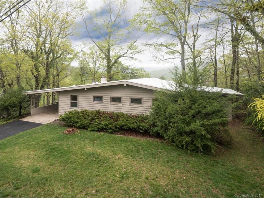 Tucked away in one of Black Mountains most pristine neighborhoods, this mid-century modern captures the majestic views of the distant mountains and beams with light, fresh paint, new flooring, roof, electric, plumbing and HVAC, this 1-level beauty boasts open spaces, vaulted ceilings and unique details that make living & entertainment their best. Minutes from golfing, Lake Tomahawk & DT Blk Mtn, the pristine surroundings & location mark this as a solid investment or, your new retirement home!