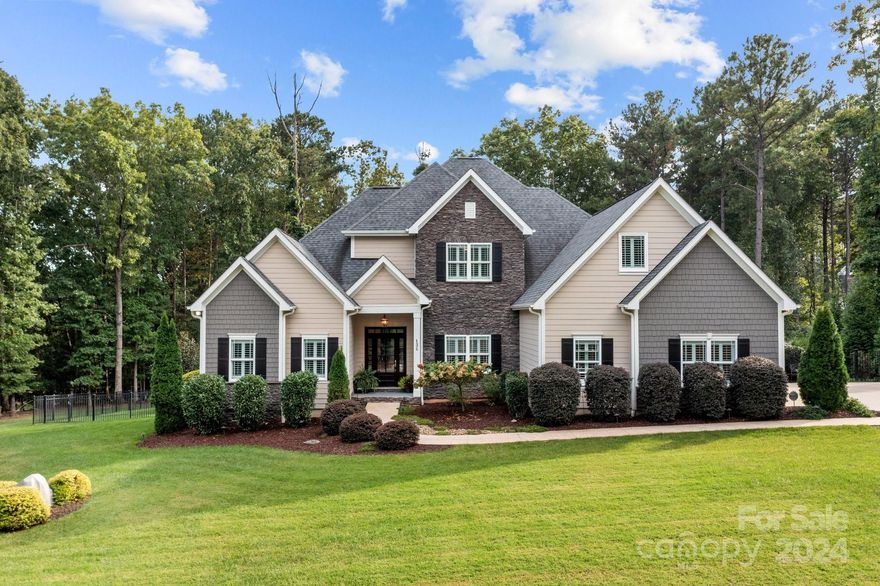Tucked away in a quiet part of town, you will love living in the peaceful neighborhood of Woodleaf w/seasonal views of Lake Norman & your own private oasis w/heated pool & spa! Custom-built craftsman-style home loaded w/upgrades! Open floor plan w/lots of natural light, hardwood floors, built-ins, heavy moldings, Smart Home features, security sys, plantation shutters & automated shades. Primary BR on the main level along w/ Office/BR + 2nd full bath w/3.0 doors & level entry for easy accessibility. Gourmet Kitchen has 42" cabinets, granite countertops, huge island, gas cooktop w/hood & walk-in pantry! Owners suite has lighted tray ceiling, stunning bathroom w/oversized tile shower, freestanding soaking tub, dual vanities & huge walk-in closet! Upstairs are guest BRs, Bonus Rm & walk-out attic access for great storage! Screened in porch & open deck leads to paver patio w/gunite pool, waterfall spa & fire pit! Beautifully landscaped w/ uplighting, irrigation & a large fenced-in backyard!