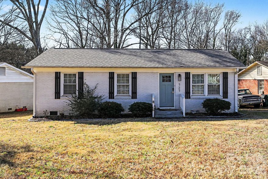 Welcome to Shady Oaks! This positively charming brick bungalow is packed with updates and character. The cozy yet spacious living room flows right into your renovated eat-in kitchen, featuring a brand new skylight! With an updated back splash, stainless steel appliances and white shaker cabinets, you'll be cooking in style and comfort.  Down the hall you'll find the primary bedroom, with a spa like updated en suite bathroom, boasting double vanity's and neutral paint. Another sunlit bedroom and full bathroom makes this ranch home the perfect space to call home. Don't miss the entertainers deck looking over your massive fenced in backyard! Just minutes from everything NoDa has to offer and close proximity to major highways, this location has it all. Schedule your tour today!