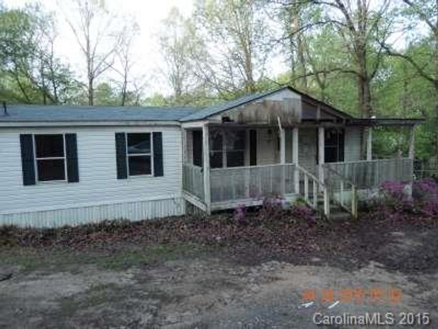 This is a Fannie Mae HomePath Property.  Large manufactured home located in a country setting.  3bd/2ba with great room. Large kitchen breakfast area.    With a rocking chair front porch sitting on 1.21 acres of land. A little TLC will make this one go a long way!