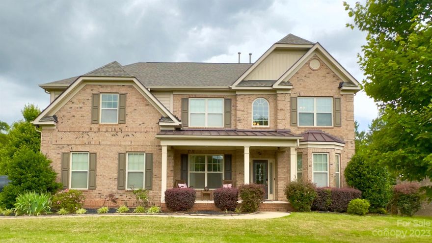 Upgrades Galore! This gorgeous 5 beds 3 full bath brick home is loaded with upgrades.  Step into this home by way of a beautiful covered front porch.  Enter into the 2story foyer near the dining room, den/office, and kitchen under lovely arches.  Some other fantastic features in this home are molding in many areas, 42 inch kitchen cabinets, granite countertops, tile backsplash, hardwood flooring, ceramic tile baths, upgraded ceilings in many rooms, bay windows in several rooms, coffered ceiling in living room, guest room on main, large bedrooms, tankless water heater, 7 zone water sprinkler system, etc...  Huge master bedroom with octagon trey ceiling.  Master bathroom has dual sinks with vanity, separate tub and shower with bench, and water closet. A new roof was just completed. A must see!!  Easy access to Lake Wylie, Charlotte, and Airport. Total measurement provided by Appraiser.  Will have exact upper and lower measurements in the near future. Asking price lower than appraisal.