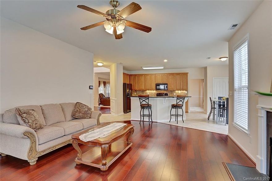 This lovely 3 story home located in North Legacy Park offers an open floor plan with formal liv/din rooms, great rm w/fire place, granite counters, tile back splash, tile/wood/carpet floors, multi-zone heat/air, prewired cable & security.  Huge master w/double sinks, shower & garden tub.  2nd floor laundry.  Huge bonus room on 3rd level! Large yard partially wooded/fenced w/shed.  Community amenities include recreational center-pool, tennis, basketball, playground, pond & gym. Home Warranty.