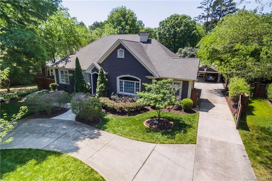 Stunning Myers Park home with fantastic open, fenced backyard with gorgeous lap pool, extensive decking & full glass panel walls/doors from master bedroom and great room. Home is minutes to Uptown, retail and restaurants. Landscaping includes irrigation system. Interior: 10' ceilings, huge arched doorways between rooms; luxurious, remodeled master bath, custom trey ceilings, 2 fireplaces, Viking kitchen appliances, no detail missed. List is too long-MUST SEE this home. Perfect home to entertain.