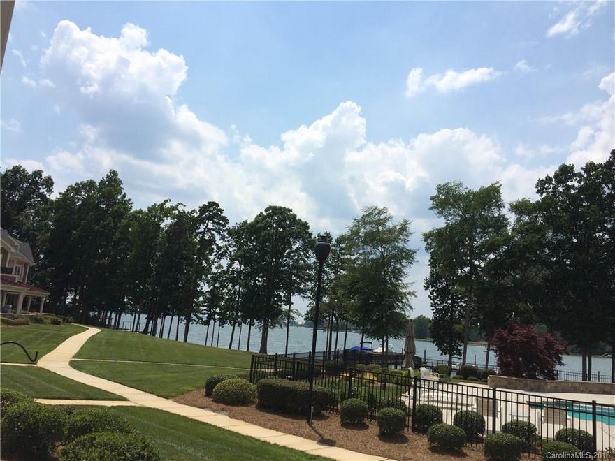 WATERFRONT  LUXURY GROUND FLOOR CONDO WITH OPEN FLOOR PLAN!! NO STEPS!!!!!! QUAINT COMMUNINTY of 19 units, exit 31, low Iredell taxes, new cherry prefinished floors, fresh paint, FABULOUS KITCHEN, granite counters, stone marble backsplash,DOUBLE OVEN, GAS STOVETOP. surround sound, central vacuum, Jacuzzi tub, master suite  LAKE/view, stainless appliances, ceramic tile baths, two garages 1 detached 1 attached, chair rail & crown molding, designer wood mantle.  Convenient to LOWES CORPORATE.