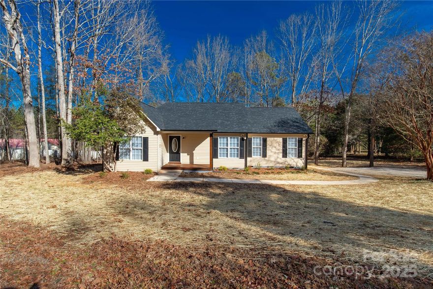 This beautifully remodeled home feels better than new, offering modern updates and thoughtful design throughout. Enjoy peace of mind with a new roof, water heater, HVAC system, appliances, flooring, fresh paint, and granite countertops. Every detail has been refreshed from top to bottom.

Set on a spacious 1-acre lot, the property provides plenty of room to relax, entertain, or garden in privacy. The rear deck is perfect for enjoying the outdoors and hosting cookouts.

Inside, the open and inviting layout features fresh neutral colors, durable luxury vinyl plank flooring, and a cozy fireplace that creates a welcoming atmosphere. The kitchen shines with new granite countertops, stainless steel appliances, and abundant cabinet space.

The primary suite includes a tray ceiling and an en-suite bath with dual vanities, while the split floor plan ensures comfort and privacy for additional bedrooms.

Fresh, stylish, and move-in ready — this renewed home is ready for its next chapter!