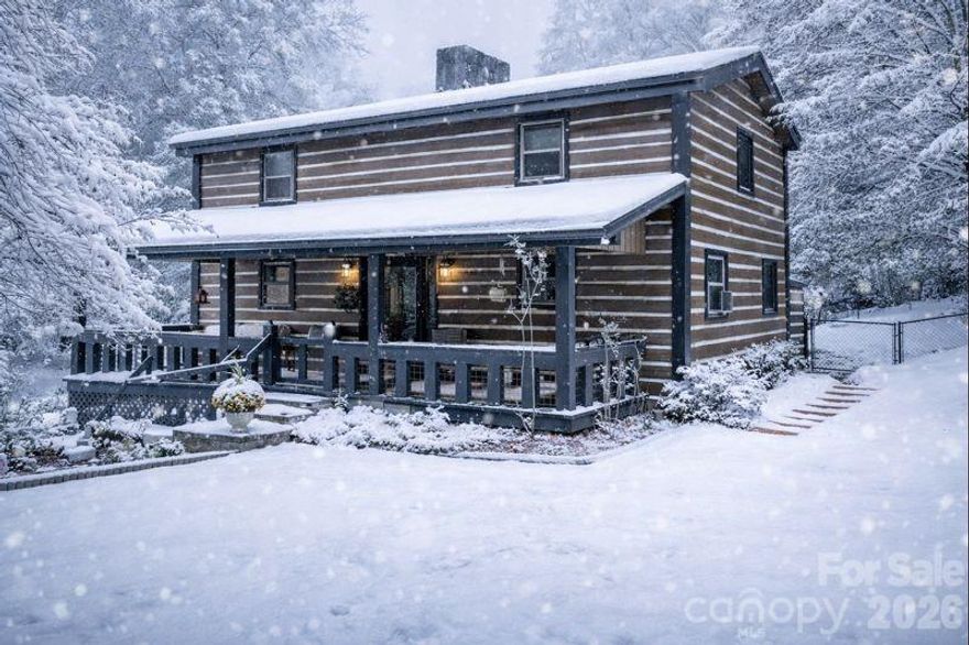 Beautiful 3BR/3BA rustic mountain cabin for sale near Lake James and downtown Marion! This well-kept home features a full front porch, exposed wood beams, hardwood floors, and a floor-to-ceiling stone fireplace. The open kitchen includes custom cabinets and stainless steel appliances. The main-level primary bedroom offers vaulted ceilings, a private deck, and a spa-like bathroom with a soaking tub, dual vanities, and a glass shower. Upstairs provides two additional bedrooms and a full bath—perfect for guests or Airbnb use. Outdoors, enjoy a fully fenced backyard, mature landscaping, and a setting framed by the warm colors of autumn foliage. Short-term rental friendly and move-in ready!