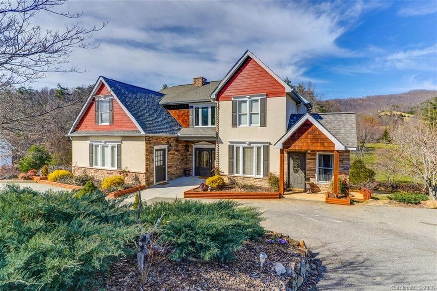 Gracious riverfront home nestled on the banks of Reems Creek & surrounded by mtn views. Custom timber-frame construction meets elegant upscale amenities & tasteful attention to detail. Remarkable stacked stone columns frame three levels of wrap around decking overlooking the hatchery supported river. Enjoy soaring ceilings & beautiful inlayed hrdwd flooring, 3-tiered crown molding, custom wainscoting, granite & marble accents throughout. FULL mother-in-law suite on lower level w/private entry.