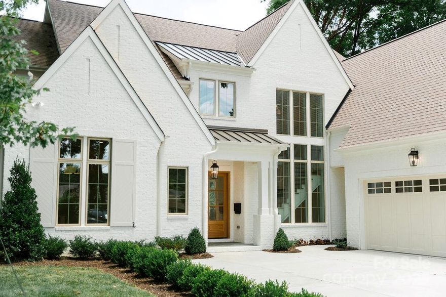 Happening in one of CLT’s most walkable neighborhoods is this stunning 5-bed, 5.5-bath home by Barringer Homes. Spanning 5,340 sq. ft on .44-acres, it offers the perfect balance of indoor and outdoor living.Interior details include a neutral color palette that creates a warm, sophisticated vibe. Vaulted ceilings w/ white oak collar tie beams add grandeur to the primary, dining, & bonus. A versatile 1st floor flex space is ideal for an office, playroom, or creative retreat. A custom DZ w/ built-in storage & a charming dog bath enhances everyday functionality.The screened-in patio with an outdoor fireplace extends the living space into a 100-foot-deep backyard, while the oversized 3-car garage provides abundant storage.Beyond its impeccable design, this home’s prime location sets it apart. Ashbrook’s exceptional walkability puts top-tier retail, dining, and entertainment just steps away. Experience a lifestyle where convenience meets luxury in one of Charlotte’s most vibrant communities.