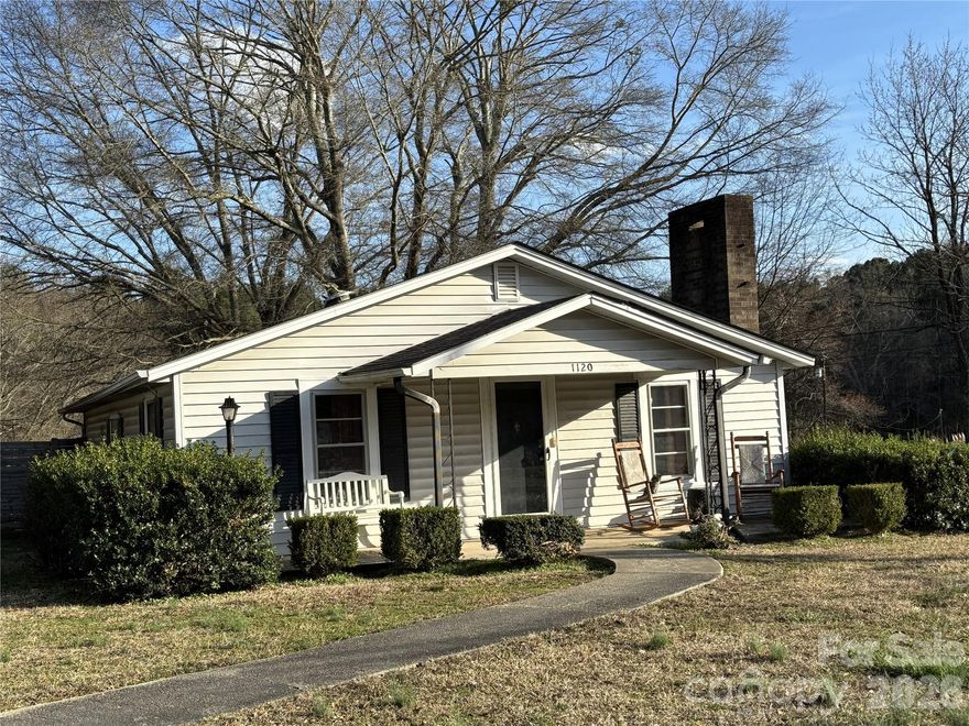 TROY - Charming 1926 bungalow in convenient Troy location. Perfect starter, downsizer, or investment opportunity. This 1-story home offers 2 bedrooms, 1 bath, and 1,041 sq. ft. on a level 0.44-acre lot with room to garden or expand.

Features include laminate/vinyl flooring, heat pump HVAC, gas log fireplace, electric range, refrigerator, porch laundry, 1-car carport, gravel driveway, county water, and slab foundation. Zoned residential on publicly maintained Hwy 134 (North Main St), just past Glenn Road. Only minutes from downtown Troy and Uwharrie National Forest access.