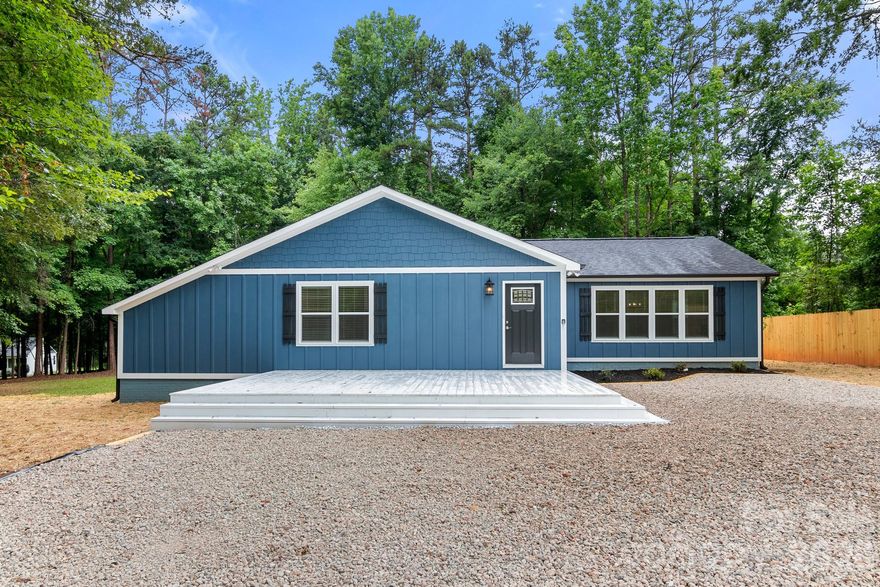 STUNNING 4 bed,3 bath home for sale in the Weddington School District! Home sits on over 2 acres on a private, wooded lot and is like NEW inside & out! Walk onto NEW LVP flooring throughout! The first of 2 primary suites features full bath w/single granite vanity, custom tile shower, 2 closets & private deck. Kitchen is AMAZING w/ NEWER SS stove, wall oven, microwave, dishwasher, pantry & HUGE island that is sure to be the center of your home! OPEN FLOORPLAN! Great room features an AWESOME custom Electric fireplace. 2nd Primary suite has vaulted ceilings, custom walk-in closet, bathroom w/dual granite vanity & custom tile shower w/another private deck! 2 guest bedrooms are great sizes w/custom closets. 3rd full bath w/single granite vanity w/tub/shower combo.  The Yard is amazing with Mature Trees.  Come see this one today!  You will not be disappointed!