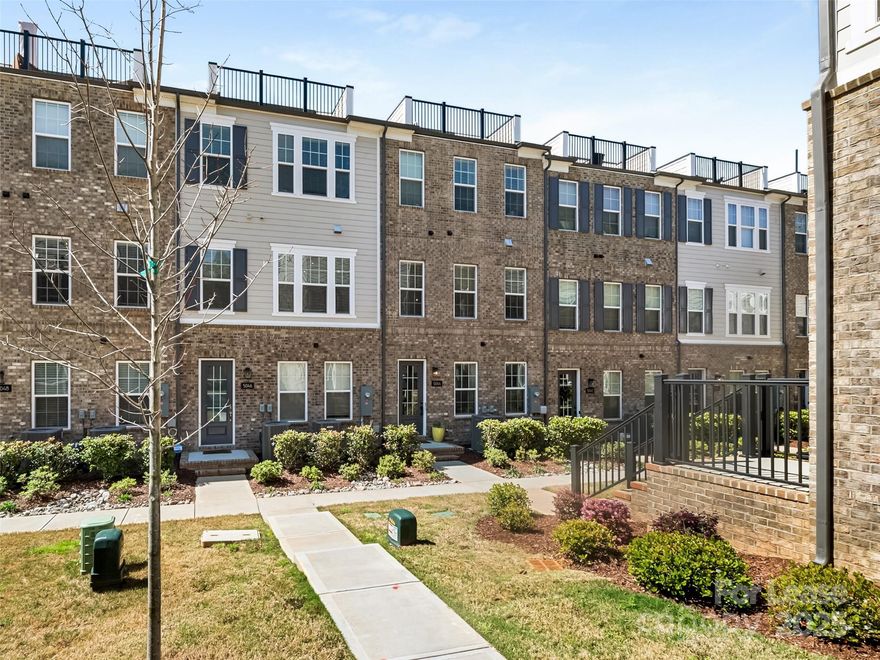 Beautiful 4-story townhome with 2-car garage & rooftop terrace. Spacious entry foyer welcomes you in with gleaming wood floors that match through the entire home (no carpet)! Lower level with secondary bedroom & full bath. Main level is open with small exterior porch. Huge living area with recess lights & fan. Cook's kitchen with huge eat-at center island, tile backsplash, 6-burner gas cook-top, under-cabinet lighting, touchless sink faucet & large pantry. Primary Bedroom with recess lights, fan, huge walk-in closet & ensuite bath. Bath features double sink vanity, large walk-in tile shower with bench & separate water closet. 3rd bedroom with ensuite bath & large walk-in closet. Flex space on the fourth floor with half bath & big roof top terrace. Garage features large storage/utility closet, outlet for charging a car, built-in storage rack & opener with keypad. Wired Google Nest doorbell with camera remains. Close to everything: minutes from Uptown, restaurants, bars, entertainment, & the Greenway! Must lease for a minimum of 6 months.