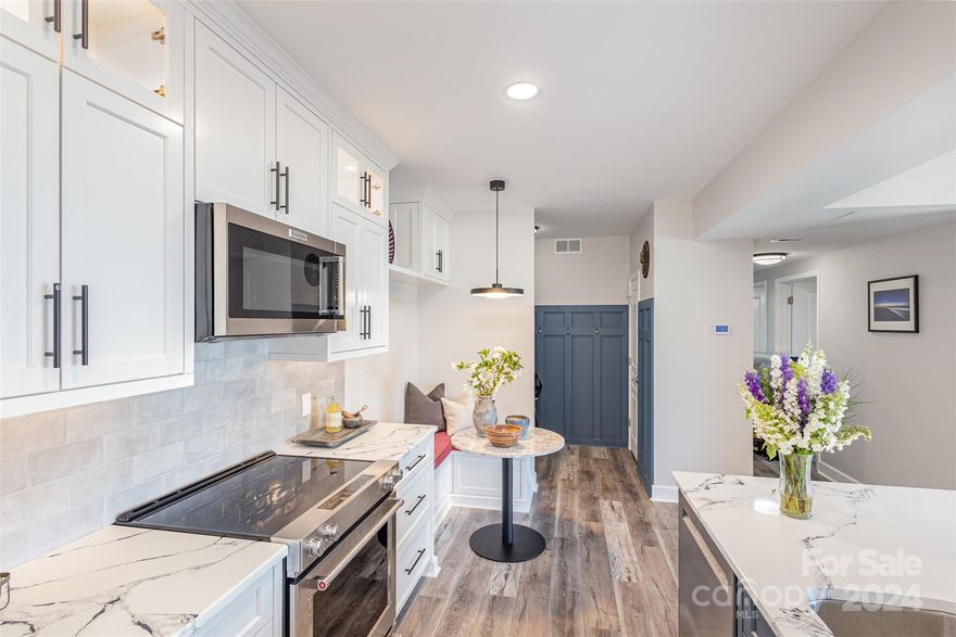 Welcome to 1315 East Boulevard, Unit 817, a stunning penthouse offering breathtaking views of Uptown. This modern 2-bedroom, 2-bathroom home has been completely renovated! Updates include a professionally designed kitchen with inset, solid maple cabinets, Quartz countertops, and new appliances. Bathrooms also boast solid maple vanities, Quartz countertops, new lighting, marble tile accents in primary, and new plumbing fixtures. New flooring and freshly painted throughout. Custom closet systems in bedrooms. Even the new washer and dryer are included. The open floor plan and private balcony provide a perfect urban retreat, while the convenience of secure entrance parking and walkable access to restaurants, shops, grocery stores, and Starbucks. All this within a 3-minute drive to Uptown make this an ideal city living location. Additionally, Freedom Park is only 4 blocks away, and the Southend light rail is just 8 blocks away. Don't miss the chance to experience the best of urban living!