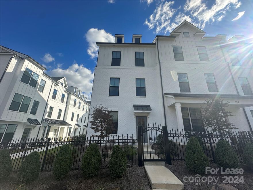 Don't miss out on this fantastic 4 bed, 3.5 bath, 1,886 sq. ft. end-unit town home with an open living area and balcony with lots of natural lighting!  
The first floor of this spacious home includes a bedroom, full bath and rear-loaded 2 car garage. On the second level, is an open great room that flows into a large eat-in kitchen with a balcony! Upgrades to the kitchen include stainless steel appliances, modern light fixtures, an undermounted sink, tile backsplash and breakfast bar island. Luxury vinyl flooring adorns the entire second floor.  Your primary suite is on the third floor, featuring a dual sink vanity and tiled shower with a shower bench. Two bedrooms and a third full bath complete the home. Washer and dryer are included for resident use.
Located near E Independence FWY, Providence Rd., grocers, dining and shopping! Please note home is unfurnished and all current furnishings will be removed prior to new resident moving in.