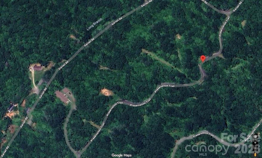 Lot 97, Preservation Trail Garnet Ridge Preserve • Sylva (Savannah), NC 28779 Lot Size: 2.39 acres (approx.) Property Type: Vacant Land / Buildable Lot Subdivision: Garnet Ridge Preserve County: Jackson County, North Carolina School District: Fairview Elementary & Middle, Smoky Mountain High School Key Features • Size: ~2.39 acres of rolling, wooded land bordering paved and gravel roads. • Terrain: Rolling slope with trees and a seasonal stream/creek on or near the lot. • Community: Gated, upscale mountain subdivision with paved tree-lined roads and underground utilities. • Clubhouse & Amenities: o Large stone fireplaces, o Clubhouse with kitchen and common area, o Sauna and shower facilities for residents. • Utilities: Underground utilities, satellite internet available; shared well & septic needed for development. • Access: Easy year-round access; about 1 hour to Asheville and 2½ hours to Atlanta. Potential Use • Residential build site: Ideal for a mountain home with minimum size conditions (e.g., ~1,500 sq ft minimum home required by community covenants). • Recreational haven: Perfect for nature lovers, with nearby hiking, fishing, kayaking, mountain biking, and outdoor exploration.