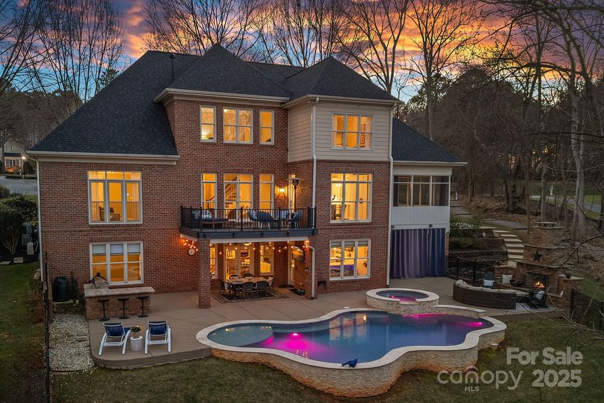 A magnificent home located in The Point w/ a deeded boat slip, nestled on 1.5 acres of privacy. Thoughtfully renovated, it features a new gourmet kitchen with elegant white cabinetry, quartz countertops, an oversized island, top-of-the-line appliances, & a coffee bar. The main level boasts a dedicated office w/ French doors, a luxurious primary suite, stylish new lighting, and a serene screened porch & deck off the kitchen for seamless indoor-outdoor living. The versatile lower level offers a chic second kitchen, spacious great room & additional living quarters, including tons of storage.
Step outside to a private retreat—an expansive Large yard on 1.59 acres w/ a Newer resort-style heated saltwater pool, travertine coping, waterfall, & spa. With over 2,500 sq. ft. of outdoor living including a out door fireplace and built in grill with a gorgeous stone island surround. Launch your kayak or stroll to your boat slip via the adjacent nature trail, & enjoy premier amenities at TNG Club.