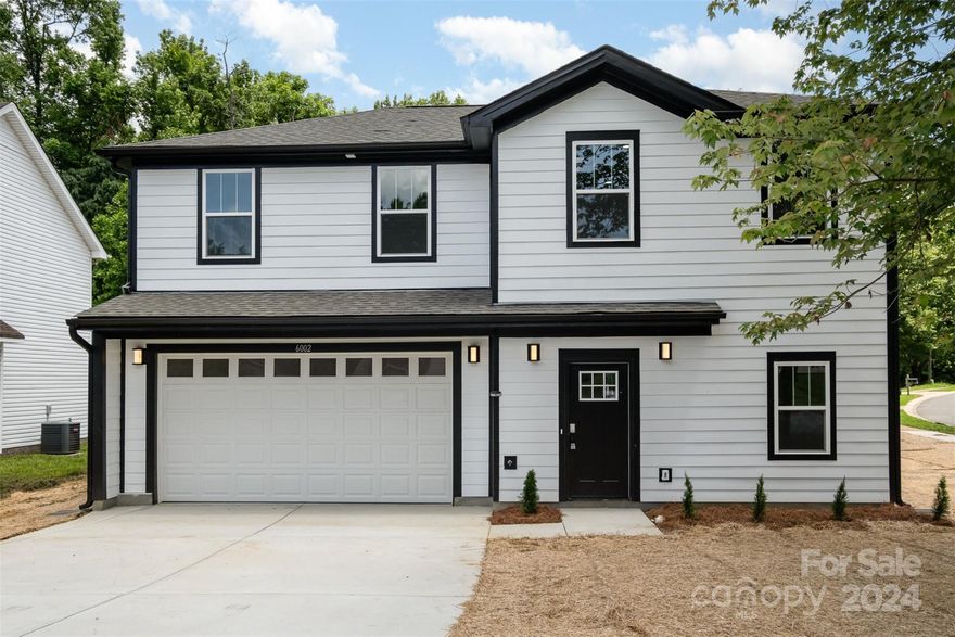 Welcome to this stunning two-story new construction on a .16-acre corner lot! Most of the homes in this neighborhood appear to have been built between 2000 and 2003, adding to its established charm. The open-concept main floor seamlessly connects the kitchen, living, and dining areas, making it perfect for gatherings. Enjoy the convenience of a two-car garage and a half bath on the lower level. The kitchen boasts stainless steel appliances, sleek countertops, ample cabinet space, and a spacious pantry. Upstairs, discover the luxurious primary suite with a large walk-in closet and a lavish ensuite bathroom, along with three additional well-sized bedrooms and two full baths. Nestled in the Oakdale Grove neighborhood, roughly 8 miles from downtown Charlotte, this home offers both convenience and tranquility. With various amenities just minutes away, everything you need is within easy reach.  Schedule your showing today before it's gone!