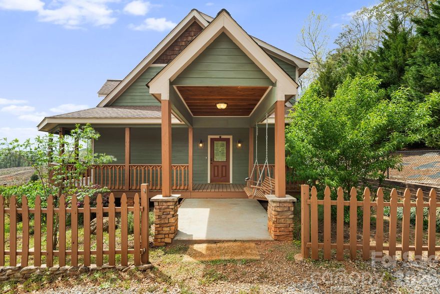Immaculate custom-built Arts & Crafts home set in a picturesque country setting on 2.64 beautiful acres. This 3BR/2BA retreat offers the perfect blend of charm, comfort, and functionality, privacy and great views!

Step inside to an inviting open floor plan highlighted by vaulted wood ceilings and a stunning floor-to-ceiling stone gas fireplace in the living room. The space flows seamlessly into the kitchen and dining area, featuring stainless steel appliances, a breakfast bar, and tile flooring—ideal for everyday living or entertaining guests.

The main level includes two spacious bedrooms, a full bathroom, and a convenient laundry closet. Upstairs, the expansive primary suite occupies the entire level, showcasing wood floors, vaulted wood ceilings, dual walk-in closets, and a luxurious ensuite bath complete with double vanities, a garden tub, and a separate tile shower.

Outdoor living is just as impressive, with a large wraparound covered porch, side porch, and a thoughtfully designed entertainment area featuring a patio, pergola, fully fenced yard, and fire pit—perfect for relaxing or hosting gatherings. 

Additional features include a detached carport with space for two vehicles and an attached storage building/shed.

Ideally located with easy access to Hwy 9, and just a short drive to Lake Lure, Chimney Rock, Rutherfordton, and the Tryon International Equestrian Center—this property combines peaceful living with convenience.

Schedule your showing today and experience this exceptional mountain retreat!