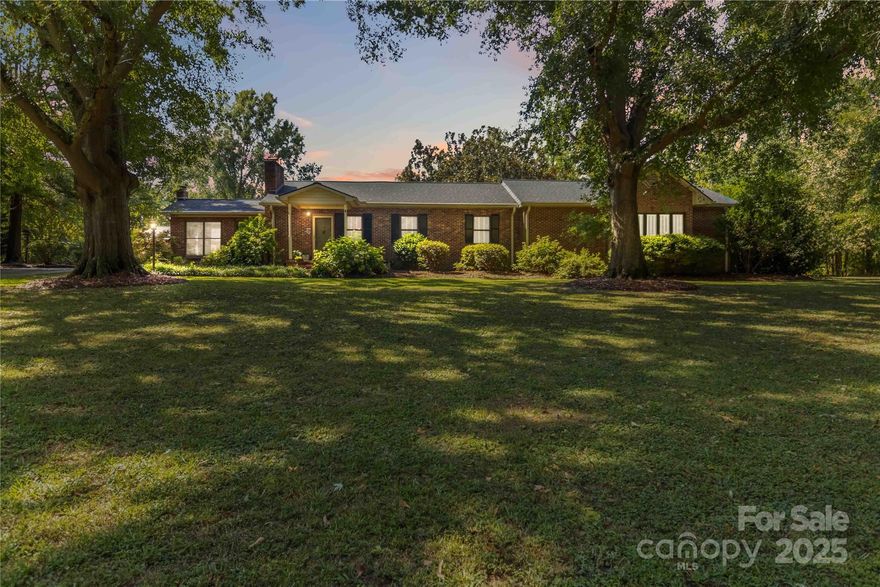 This exceptional home looks like it was pulled straight from the pages of Southern Living! Nestled on 9 peaceful acres, it offers true rural charm with space to relax and entertain. Enjoy an outdoor kitchen with natural gas grill, stainless steel sink, ceiling fans, fridge, and two gas fire pits-perfect for gatherings. A detached
3-bay garage provides extra storage and functionality. Inside, the home boasts oak flooring throughout, a fully remodeled kitchen with custom pull-out cabinetry, granite counters, stainless steel appliances, and a wet bar with a new ice maker. Both bathrooms have been updated with granite, tile, and a luxurious primary suite renovation. Additional upgrades include a stamped concrete patio with accent lighting, newer gutters and roof (2018-2019), Bose outdoor speakers, and tile floors in the sunroom and mudroom. This home is a rare blend of comfort, style, and serenity-don't miss it! - back on the market at no fault of the seller.