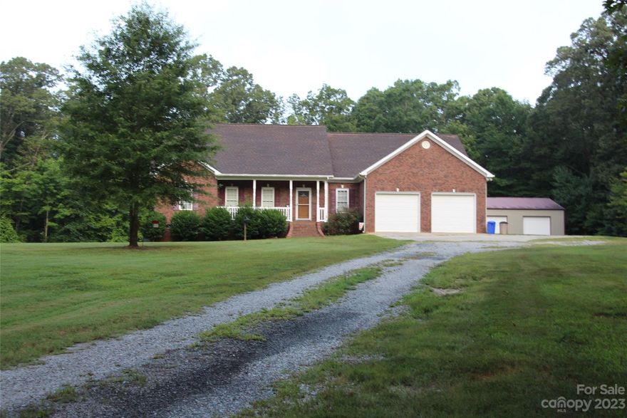 A RARE FIND!!!  Enjoy your privacy in this Brick Country Home located on 7.94 acres in Buford School District.  The main bedroom suite features two separate vanities, whirlpool tub/separate shower, two walk-in closets. The large family room has built in bookshelves.  Kitchen/Dining Combo with plenty of counter space with pantry cabinet.  This split-floorplan home has large walk-in closets in Bedrooms 2 and 3.  You will also find the home office and laundry room on the first floor.   Bonus area upstairs has 910 sq. ft. of finished space for your hobbies, game room, playroom, etc.  This home includes plenty of storage w/two linen closets, coat closet, storage under stairs, plus walk in attic space.  2 car attached garage with remotes.  Plus, 40x30 workshop with two garage doors. Approximately 5 acres is wooded.   Located 1/2 mile from intersection with Hwy. 522 for easy access to Monroe.  Deck to be removed and smaller deck installed.   Hot Tub not included.  Broker is relative of owner.