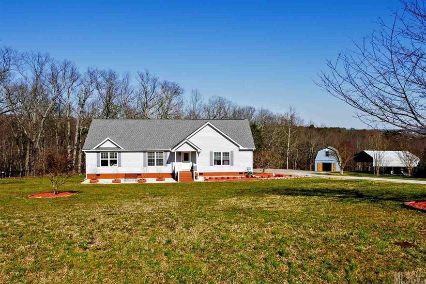 If you are looking for a place with plenty of room to roam this is the home for you! 5 bedrooms and 2 bathrooms with 6.45 acres! Split bedroom floor plan with open living room that includes a gas log fireplace and dining room. Large kitchen with many cabinets and lots of counter space with adjoining laundry room. Master bedroom offers large walk in closet, with a bathroom featuring a double vanity and large garden tub and separate shower. Upstairs two bedrooms and a den were permitted and completed in 2013 and has a separate heat pump. Outside is a large deck for entertaining with gazebo and fenced in backyard. Outbuilding for storage and double detached carport. Many blueberry plants are planted in the field below the outbuilding. The septic system had lines added in 2013 to allow for additional bedrooms and has been pumped in February 2016.  5th bedroom does not have a closet but one can be easily installed. New Trane HVAC installed March 2016.