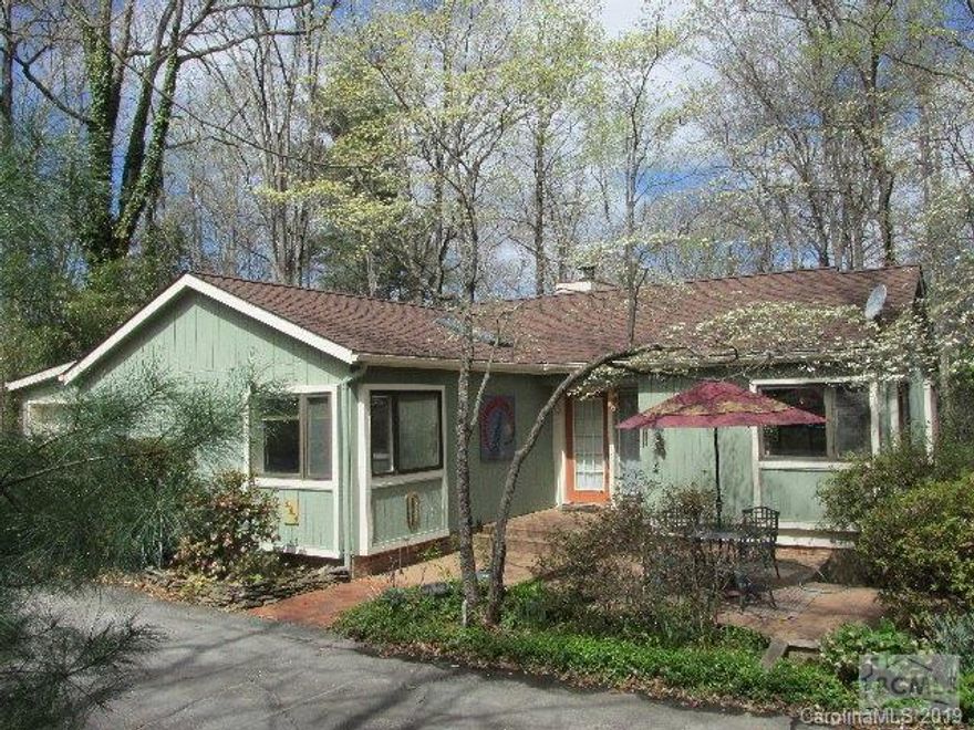 Reduced Price on this Attractive,contemporary style, 4 Bedroom, 3 Bath home in desirable Forest Hill area, designed by architect Marvin Folger. Open floor plan with floor to ceiling windows provides bright sunny rooms throughout. Great room with Bamboo flooring,wood-burning fireplace, built-ins ,dining area overlooks wooded backyard. Kitchen with its corner windows,pantry,overlooks patio in front of home. 2 Master Suites on main floor, each with tub/shower,single vanity. Walk-out level with Family Room wired for kitchenette, 2 additional Bedrooms and full Bath. Tons and Tons of Closets and Storage throughout. Work shop area. New Roof 2013. Fenced area in back. Single car garage. Circular Drive. Large,wooded, double lot. Walk to downtown Morganton for shopping and entertainment