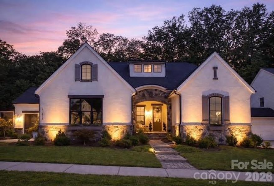 This stunning Santa Fe–style 1.5-story home offers luxury, functionality, and an open-concept design with premium finishes throughout. The gourmet kitchen features an oversized island seating six, a scullery, and seamless flow to the dining area and great room with soaring 12-ft ceilings. Expansive glass doors open to a covered outdoor living space, perfect for entertaining. The main level includes a spacious primary suite with spa-like bath and direct laundry access, two additional bedrooms with Jack-and-Jill bath, a private office, and a convenient drop zone off the 3-car garage. Upstairs offers a large bonus room, additional bedroom, and full bath—ideal for guests or flex space. Enjoy a professionally landscaped, private backyard with stamped concrete patio, wood gazebo, and room for a pool. Premium features include whole-house water filtration with reverse osmosis, epoxy garage floors, included washer/dryer/refrigerator, extensive Ethernet wiring, smart-home connectivity, gas grill hookup, and pre-wired patio heaters. Prime Huntersville location minutes to I-77, Birkdale, shopping, dining, and Charlotte.
LOCATION! LOCATION! LOCATION!