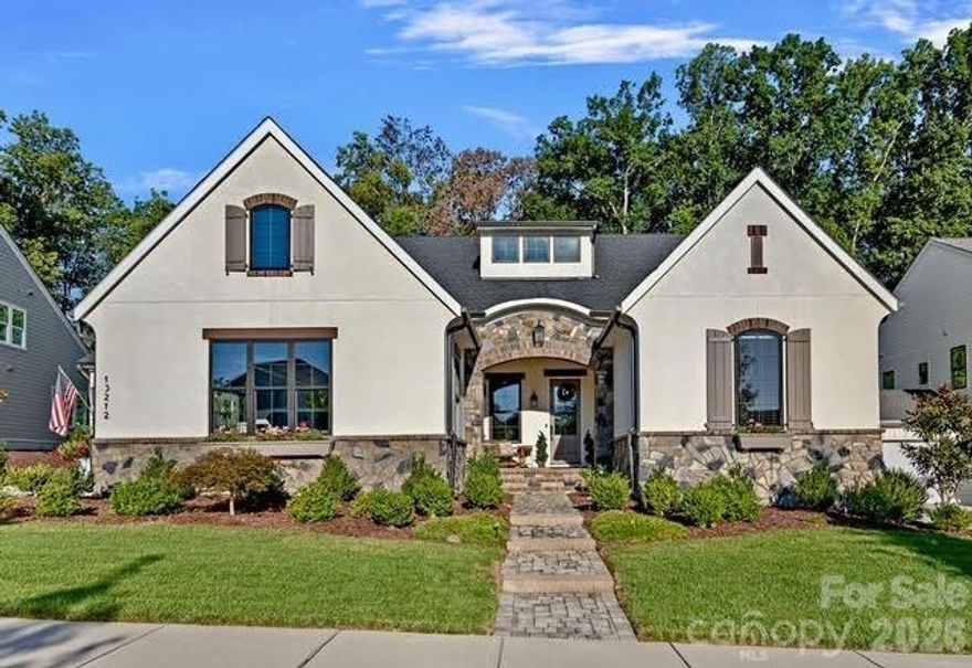 This stunning Santa Fe–style 1.5-story home offers luxury, functionality, and an open-concept design with premium finishes throughout. The gourmet kitchen features an oversized island seating six, a scullery, and seamless flow to the dining area and great room with soaring 12-ft ceilings. Expansive glass doors open to a covered outdoor living space, perfect for entertaining. The main level includes a spacious primary suite with spa-like bath and direct laundry access, two additional bedrooms with Jack-and-Jill bath, a private office, and a convenient drop zone off the 3-car garage. Upstairs offers a large bonus room, additional bedroom, and full bath—ideal for guests or flex space. Enjoy a professionally landscaped, private backyard with stamped concrete patio, wood gazebo, and room for a pool. Premium features include whole-house water filtration with reverse osmosis, epoxy garage floors, included washer/dryer/refrigerator, extensive Ethernet wiring, smart-home connectivity, gas grill hookup, and pre-wired patio heaters. Prime Huntersville location minutes to I-77, Birkdale, shopping, dining, and Charlotte.
LOCATION! LOCATION! LOCATION!