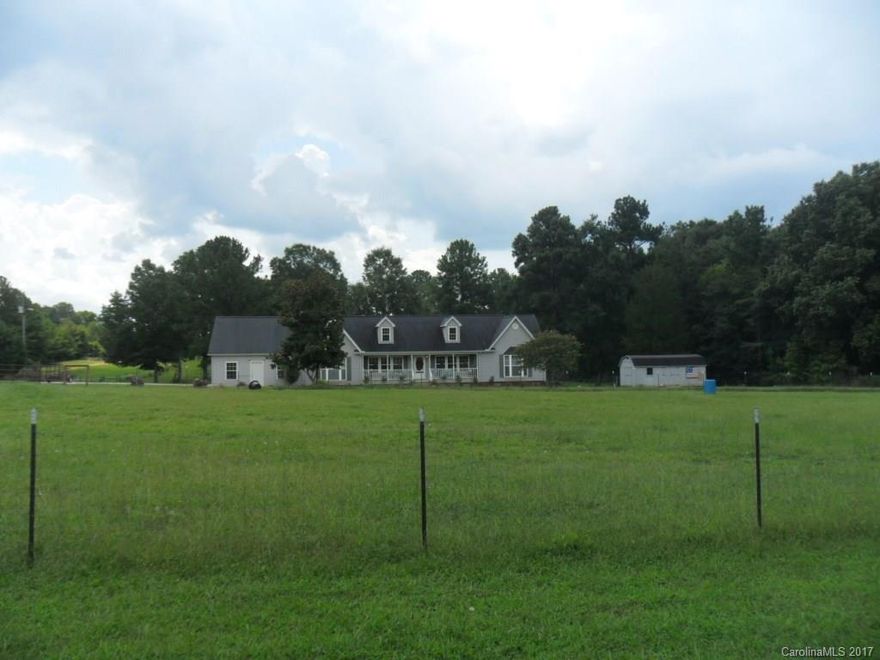 Gorgeous home!  This well maintained home sits on 5 acres.  Home has fenced in front and back pasture.  Large split bedroom floor plan.  Master on main along with guest bedroom.  Upstairs is 2 additional bedrooms, separate den, full bath, and walk in attic.  Great room features a beautiful fireplace with windows on either side.  Master bath has steps leading up to huge tub.  Separate shower and double vanity.  The kitchen has a island and a ton of cabinets w/ rollouts.  This is not one to miss.