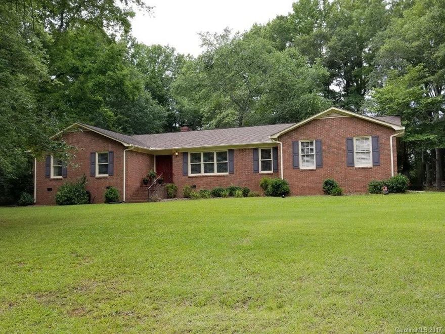 Are you looking for a quiet setting that is still convenient to everything? The you have found your forever home! 8 to 10 minutes to I-77 and shopping. Enjoy morning coffee on the deck after your early morning swim in this private back yard that is brimming with beautiful flowers & lush greenery. Custom brick home has 4 bdrs, formal areas, lg family room with a built in book case & desk area. FR has wood burning FP, Kit has BF area, lg ldry, with good storage, plus lg storage area off the Gar.