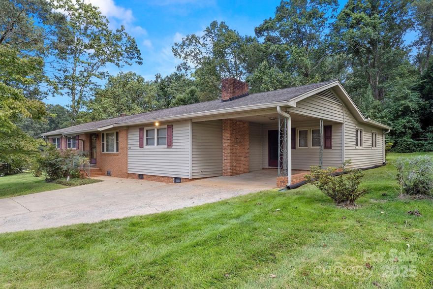 Well-maintained home on a spacious 3.28 acre corner lot in the quiet countryside ready for your personal touch! Great bones, newer windows, and large rooms! Living room, spacious kitchen w/ wood cabinets, tons of counter space, and refrigerator included, den with fireplace, large bonus room, three bedrooms and two baths. Laundry room is inside but is not counted in HLA because it is unfinished. Large primary bedroom with ensuite bath that has a handicap accessible shower. Beautiful lawn and field with large barn that has water and electricity. Mature trees create privacy and ambiance. Old greenhouse could be revived! Other amenities include a whole house generator, additional storage building, great pantry, and sellers are offering a ONE YEAR HOME WARRANTY for buyers' peace of mind! House has county water, but barn is on well water. Sellers state that there are hardwoods under most floors, but buyers will need to verify. This listing is for 3.28 acres - parcel 30692 which includes the house.  Septic permitted for 3 bedrooms. Schedule your showing today!