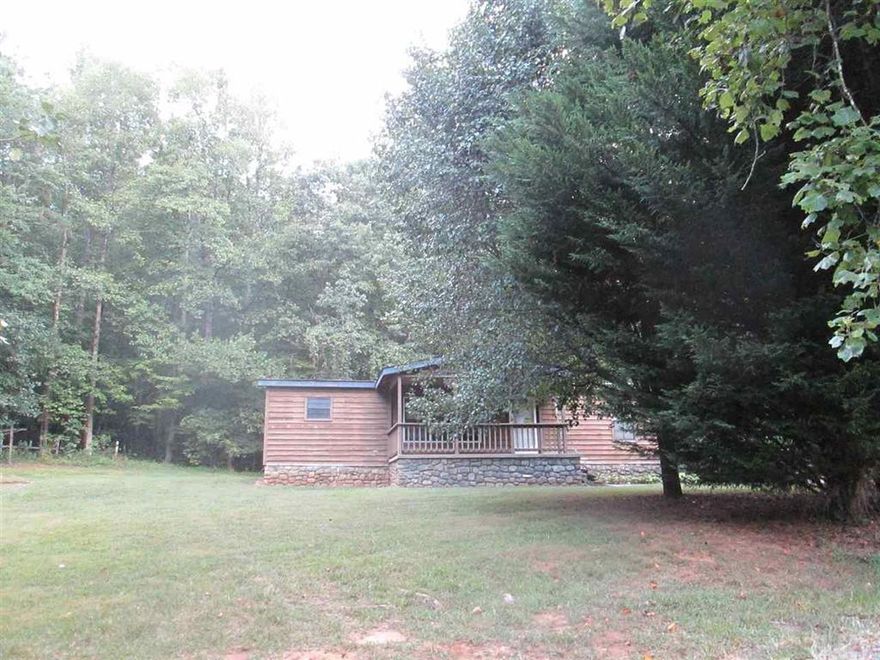 Private, convenient location at the end of Red Barn Lane but yet close to downtown Lenoir and just off of Morganton Blvd.  Manufactured house on .63 acre lot with 2 bedrooms and 2 baths and stone fireplace.   Includes a detached single garage with spacious workshop.