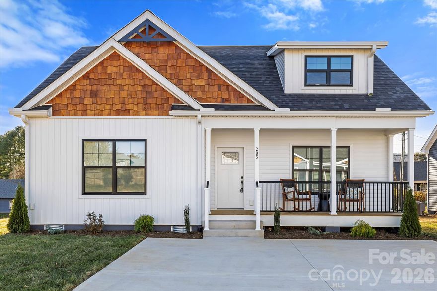 This charming new construction home is nestled in a small culdesac community minutes away from The Arboretum, Bent Creek & Biltmore Park amenities. The front facade, with it's welcoming front porch and Craftsman details, sets the tone for the warm & cozy interior that awaits.  The light & bright open floorplan includes a spacious great room with 9' coffered ceilings and large windows. A sunny dining area opens onto a rear deck perfect for grilling. The kitchen offers a large island, pantry cabinets, tile backsplash and the ultimate spot to flex your green thumb. A generous primary bedroom on the main level leads into an ensuite bathroom w/ double vanities, LED mirrors, and an epic tiled shower w/ 2 heads and flip down seating.  The bathroom smartly connects to the main level laundry which also has a hallway entrance. A large coat closet and well placed powder room round out the first floor. Upstairs you will find an oversized landiing perfect for an office area or flex space, 2 sizeable bedrooms w/ huge closets, and a full bath.  Outside, a small level yard provides an undemanding space to play or plant w/ mountain views beyond.  This home and community offer easy breezy living at an accessible price point, all within 20 minutes of downtown Asheville.