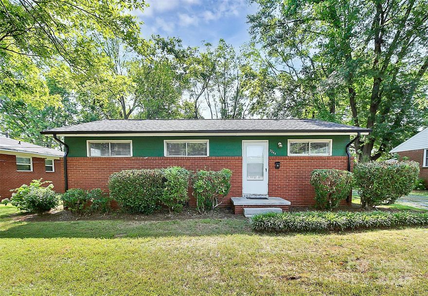 Updated 3-bedroom, 1-bathroom residence perfectly blends modern convenience with classic charm. Step inside to discover a bright and inviting living space featuring hardwood floors that extend throughout the home. Cook and entertain with ease in a beautifully updated kitchen that boasts sleek blue cabinets, stone countertops, and stainless steel appliances. The beautiful grey tile floors add a touch of elegance and make for easy maintenance. Relax in the comfort of three spacious bedrooms, each with ample natural light and hardwood flooring. The updated bathroom is stylishly designed, offering contemporary fixtures and finishes. Conveniently located just minutes from I-85 and Uptown Charlotte, you'll enjoy easy access to shopping, dining, and entertainment, as well as a straightforward commute. This home offers the perfect blend of comfort, style, and location, making it a must-see for anyone looking to settle in the vibrant Charlotte area.