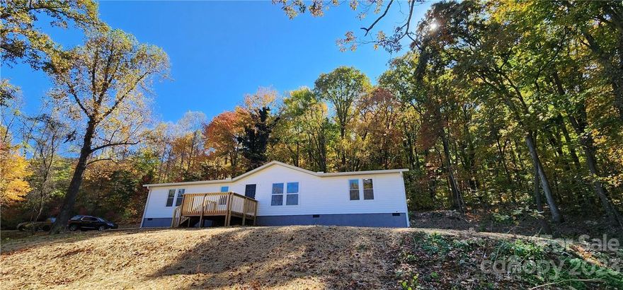 Incredible like-new mobile home on a level to gently sloping nice piece of property. 1-year-old roof, windows,  kitchen, and bathroom cabinets. 1-year-old vinyl plank floors throughout the main level and carpet in 2 of the 3 bedrooms.  Fairly new plumbing fixtures, and fairly new stainless steel appliances. Nice light fixtures and ceiling fans. 1-year-old Trane Heat and Air! There's a separate concrete slab that would be great for a building, a basketball court, or whatever your heart desires.  New deck in the back and a swimming pool. There's a nice large deck in the back of the kitchen to BBQ on and enjoy nature. There's also a front deck to sit on and enjoy your view. Lots of great outdoor space for a garden, chickens, goats, and other animals. Highest and Best offer is due 2-2-2023 at 4PM.
