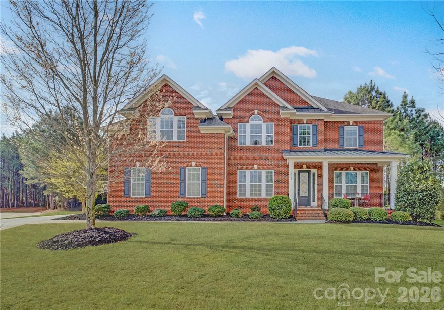 Located in the gated Eagles Landing community within the amenity-rich Palisades, this full brick home welcomes you with a charming covered rocking chair front porch and a grand two-story foyer. A private study with French doors sits just off the entry, while the gracious dining room across the foyer offers flexibility as a formal entertaining or receiving space. The gourmet kitchen is beautifully appointed with a gas cooktop, wall oven, ample skyline cabinetry, and an oversized prep island with a double-bay sink, seamlessly flowing into the breakfast area and inviting living space—perfect for everyday living and entertaining. Step outside to the stunning screened porch overlooking a serene, gated backyard. A main floor guest suite offers versatility as a secondary office or private retreat. Upstairs, the spacious primary suite features a tray ceiling, dual vanities, a soaking tub, a glass-enclosed shower, and a walk-in closet, while bedrooms two and three share a Jack-and-Jill bath, and bedroom four has access to a hall bath. A huge bonus room completes the upper level, providing endless possibilities for recreation or relaxation. Residents of The Palisades enjoy a true resort-style lifestyle with community amenities that include a clubhouse, pool, fitness center, tennis courts & miles of scenic walking trails. In addition, the private Palisades Country Club offers optional social and golf memberships, featuring a Jack Nicklaus-designed 18-hole golf course, elegant clubhouse dining, tennis complex, swimming facilities, fitness center, and a full calendar of social events designed to enhance an active and connected lifestyle