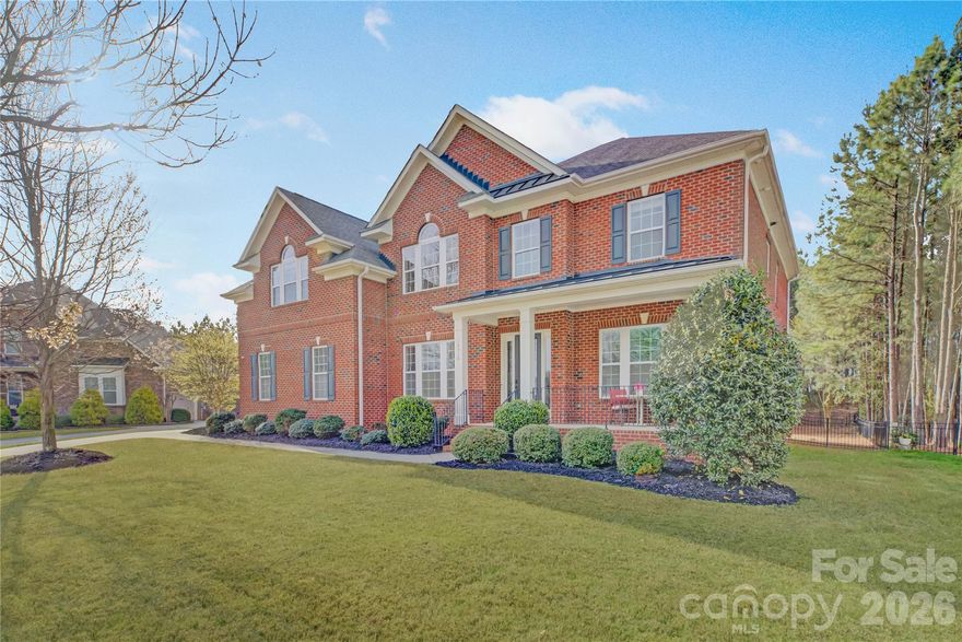 Located in the gated Eagles Landing community within the amenity-rich Palisades, this full brick home welcomes you with a charming covered rocking chair front porch and a grand two-story foyer. A private study with French doors sits just off the entry, while the gracious dining room across the foyer offers flexibility as a formal entertaining or receiving space. The gourmet kitchen is beautifully appointed with a gas cooktop, wall oven, ample skyline cabinetry, and an oversized prep island with a double-bay sink, seamlessly flowing into the breakfast area and inviting living space—perfect for everyday living and entertaining. Step outside to the stunning screened porch overlooking a serene, gated backyard. A main floor guest suite offers versatility as a secondary office or private retreat. Upstairs, the spacious primary suite features a tray ceiling, dual vanities, a soaking tub, a glass-enclosed shower, and a walk-in closet, while bedrooms two and three share a Jack-and-Jill bath, and bedroom four has access to a hall bath. A huge bonus room completes the upper level, providing endless possibilities for recreation or relaxation. Residents of The Palisades enjoy a true resort-style lifestyle with community amenities that include a clubhouse, pool, fitness center, tennis courts & miles of scenic walking trails. In addition, the private Palisades Country Club offers optional social and golf memberships, featuring a Jack Nicklaus-designed 18-hole golf course, elegant clubhouse dining, tennis complex, swimming facilities, fitness center, and a full calendar of social events designed to enhance an active and connected lifestyle