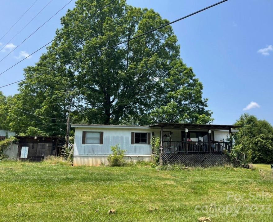 Investor special! AS IS - This home sits on 2.02 acres of unrestricted land in the popular Alexander community. This is a 3 bedroom, 1 full bath doublewide. Lots of potential with this one. Nice hardwood floors. Spacious, covered front porch to enjoy the view! There is room on the property to put up another home, or two. Short term rentals allowed! No restrictions! Shared well and driveway with 982 Fletcher Martin Rd. Photos coming 5/24/2023