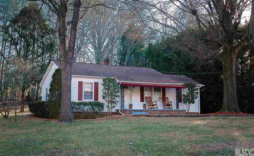 Price Reduction! Charming MOVE-IN READY 3 BR home conveniently located near shopping, schools and parks yet tucked away on a private lot.  Easy commute to Hickory or Charlotte. Tastefully upgraded in fresh modern colors. Real wood flooring.  Spacious dine-in kitchen w/gorgeous custom cabinetry, quality appliances and tile flooring.  Relax on the rocking chair front porch with awning.  Lovely level yard to play in under the shade of mature hardwoods with established landscaping.  Lovingly well-maintained.  Move in and enjoy!