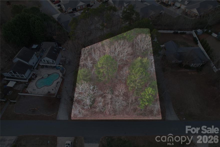 .47-acre lot with water views of Lake Norman and mature trees providing potential coverage following a new build. City water and sewer available. No HOA and no build restrictions—bring your plans and build your way. A rare opportunity for flexible ownership in a desirable setting. Follow Unity Church Road to see public access/boat launch to Lake Norman - Beatty's Ford Park.