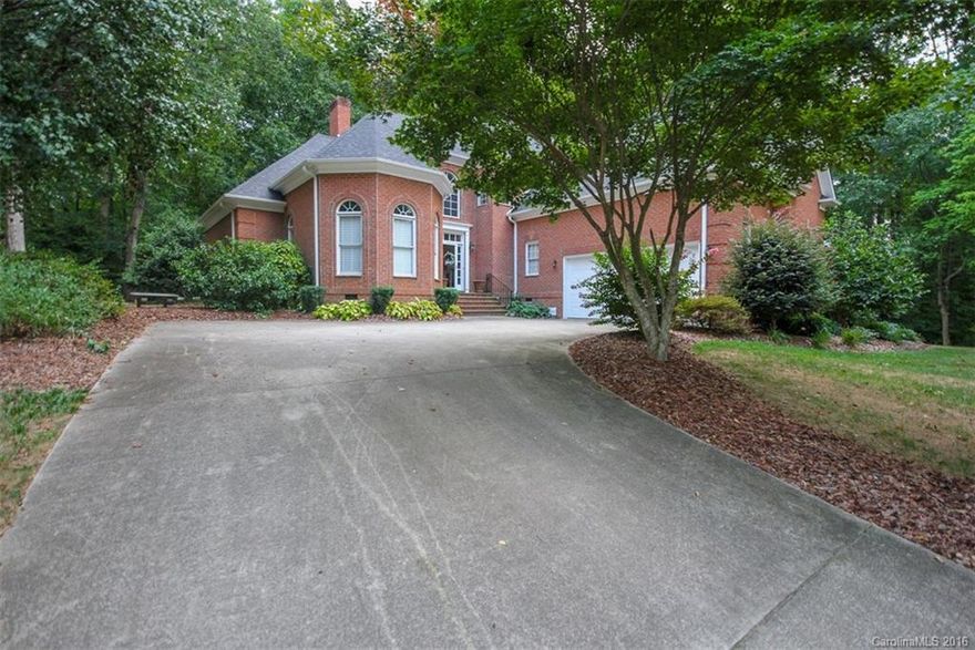 Welcome to this IMMACULATE, move in ready home. This home boast many desirable features with hardwood floors and a stacked stone fireplace in a 2-story great room. The large master suite is on main level with access to screen porch overlooking private, wooded back yard.  Updated kitchen with granite and SS appliances and formal dining room. Each bedroom has it's own full bath!  This home has been well maintained with a new roof installed in 2013, and new downstairs HVAC in 2106. Large wooded lot