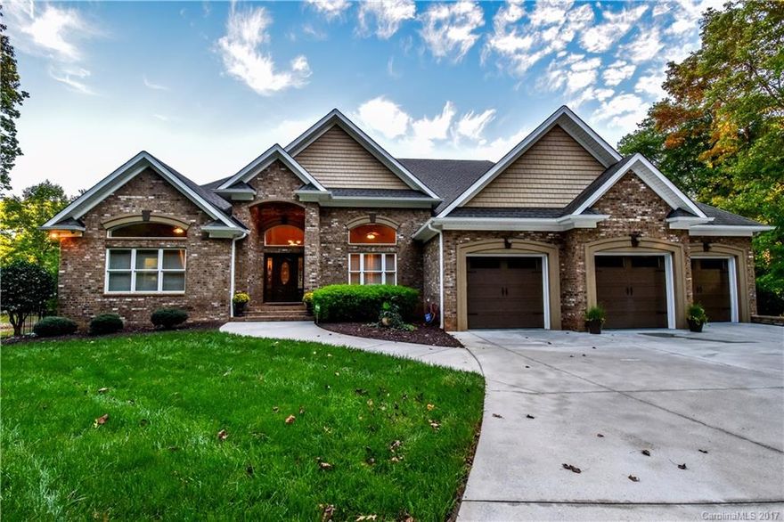 Stunning, full brick lakefront home is elegant and cozy! This 4bed/4bath home has 2 kitchens, 2 expansive family rms that overlook the lake, dining rm perfect for large gatherings, a huge laundry room & ample closet storage. All bedrooms are exceptionally large plus an extra room in the basement that can sleep multiple people. Basement also has large game room great for indoor activities. Gorgeous pool & 2 patios make this home ideal for entertaining.  Home will NOT disappoint!